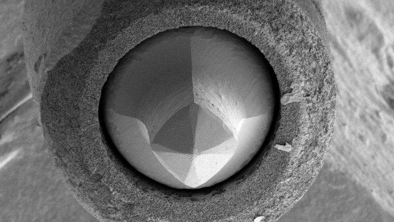 Lanthanum hexaboride (LaB6) cathode (Kimball Physics Inc.) after about 2 ½ years use as the electron source in the CAIC Tecnai TEM. The LaB6 crystal at the centre is held in place by a carbon ferrule (round, surrounding structure) and shows shortening and